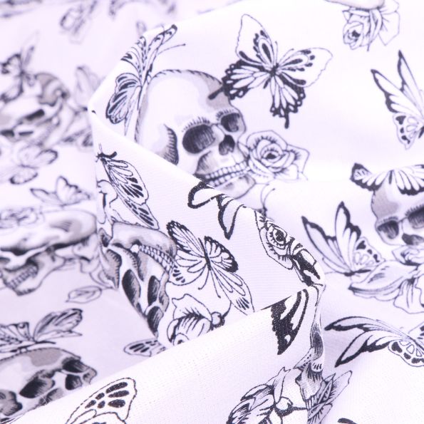Tissu Coton imprimé Arty Têtes de mort et papillons sur fond Blanc - Par 10 cm