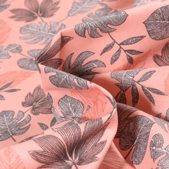 Tissu Coton enduit Sun leaves sur fond Rose - Par 10 cm