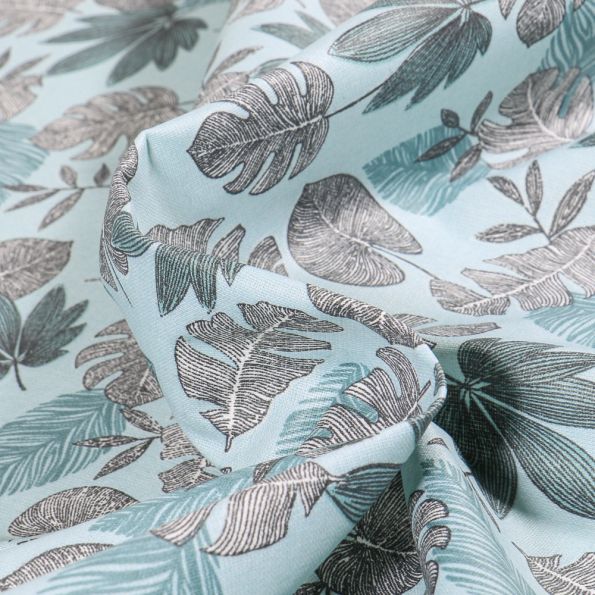 Tissu Coton enduit Sun leaves sur fond Bleu clair - Par 10 cm