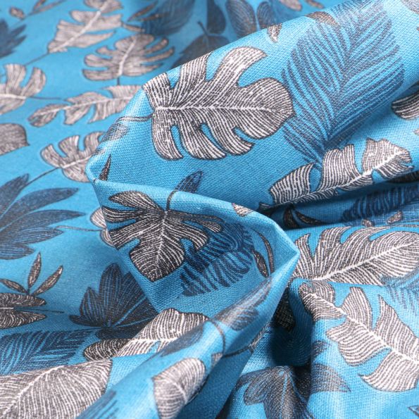 Tissu Coton enduit Sun leaves sur fond Bleu - Par 10 cm