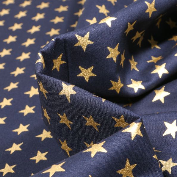 Tissu Coton imprimé Etoiles dorées 1 cm sur fond Bleu marine - Par 10 cm