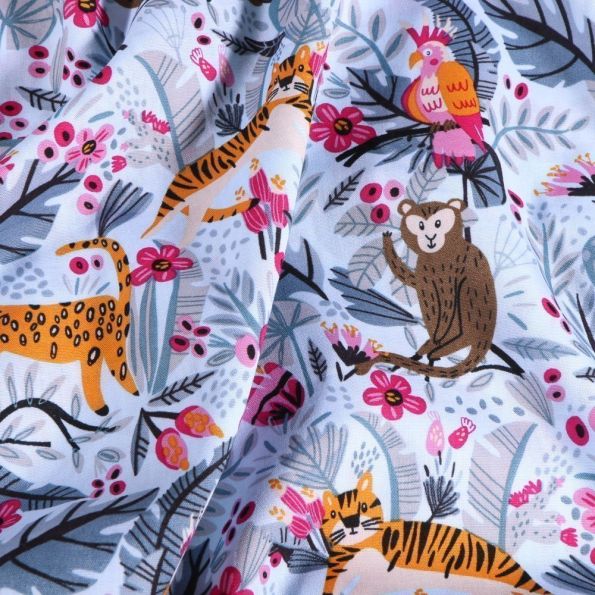 Tissu Coton imprimé Animaux de la jungle sur fond Bleu ciel - Par 10 cm