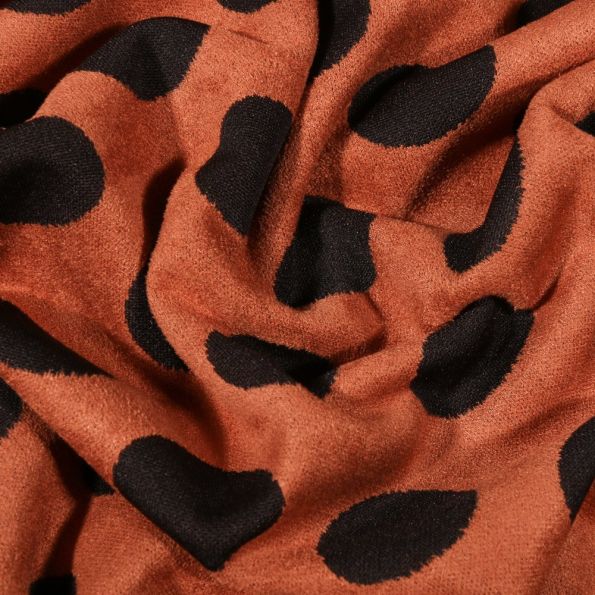 Tissu Suédine Jersey Pois noirs sur fond Brique - Par 10 cm