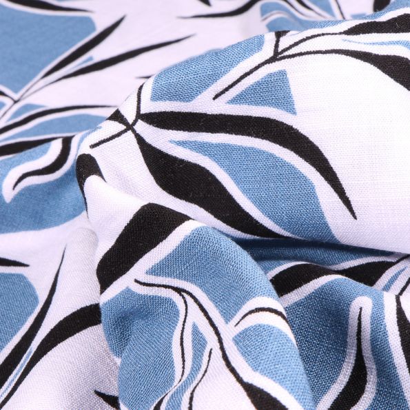 Tissu Viscose extensible Feuilles de bambou sur fond Bleu ciel - Par 10 cm