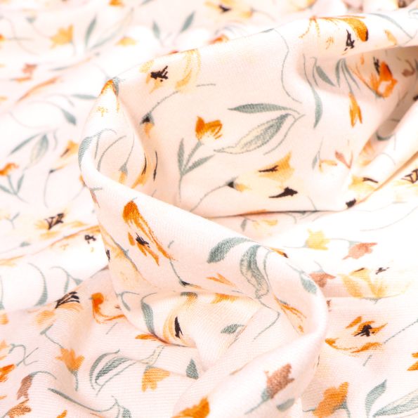 Tissu Jersey Viscose  Tess sur fond Blanc cassé - Par 10 cm