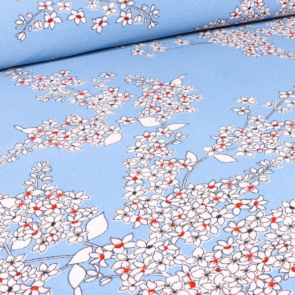 Tissu Crêpe georgette Lola sur fond Bleu ciel - Par 10 cm