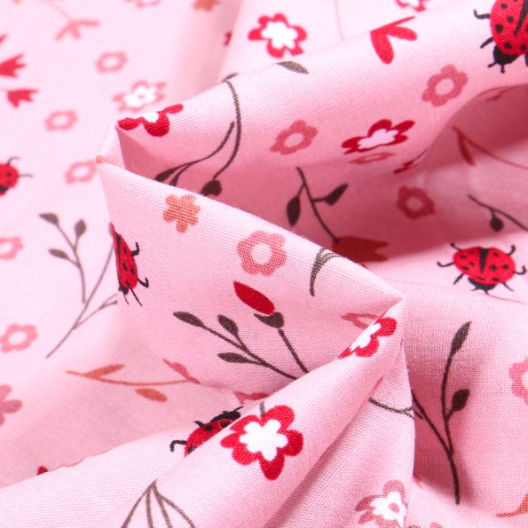 Tissu Coton imprimé Ladybug Coccinelle et fleurs sur fond Rose - Par 10 cm
