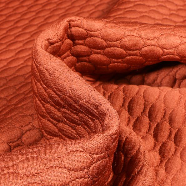 Tissu Sweat matelassé Alvéoles ovales sur fond Brique - Par 10 cm