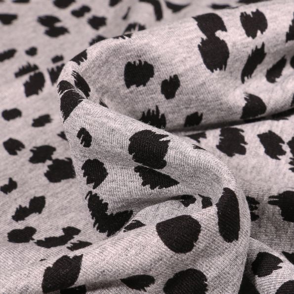 Tissu Jersey Viscose Taches dalmatiens sur fond Gris chiné - Par 10 cm