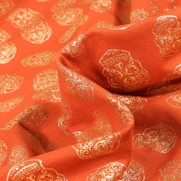 Tissu Jersey Coton Têtes de morts métallisées sur fond Orange - Par 10 cm