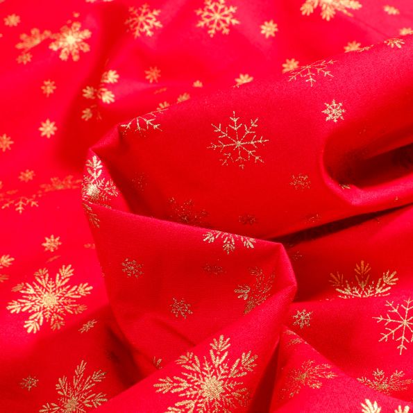 Tissu Coton imprimé Flocons de neige dorés sur fond Rouge - Par 10 cm