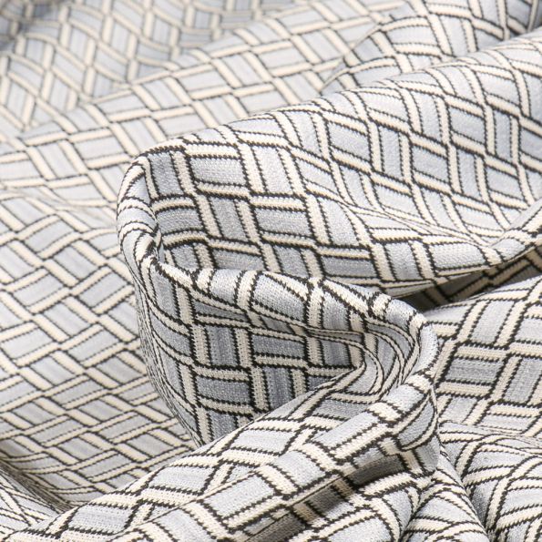 Tissu Maille Jacquard Zig zag sur fond Gris clair - Par 10 cm