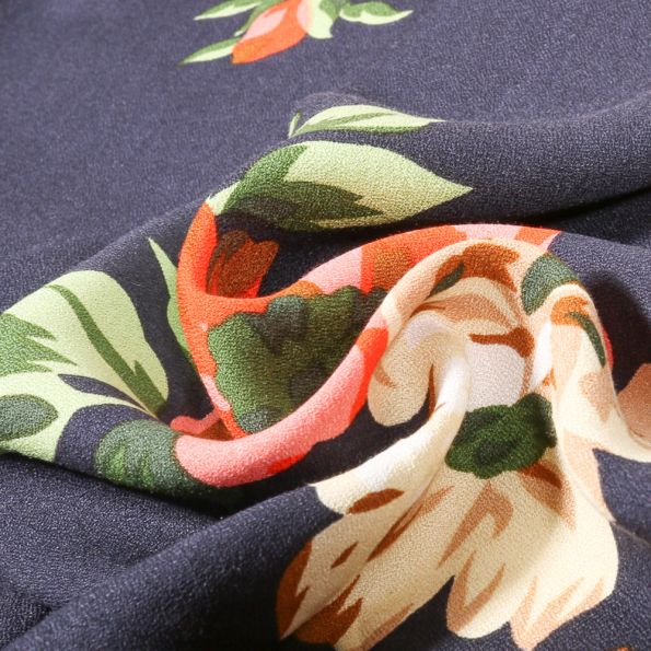 Tissu Crêpe de Viscose Flowers orange sur fond Bleu denim - Par 10 cm