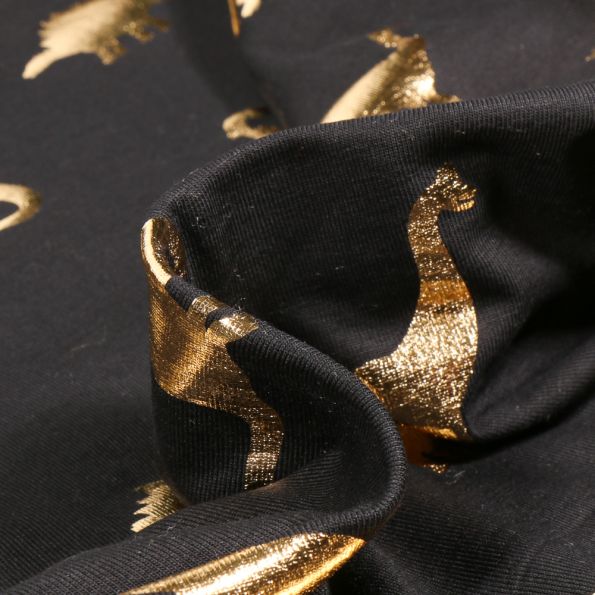 Tissu Jersey Coton Dino métalissé doré sur fond Noir - Par 10 cm