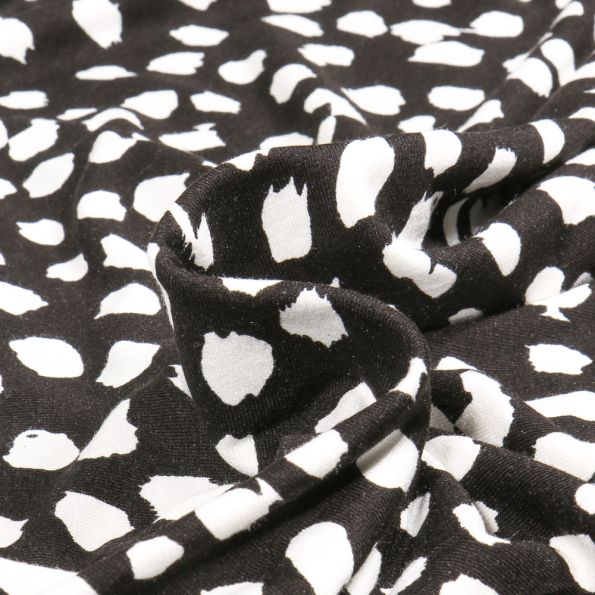Tissu Jersey Viscose Taches sur fond Noir - Par 10 cm