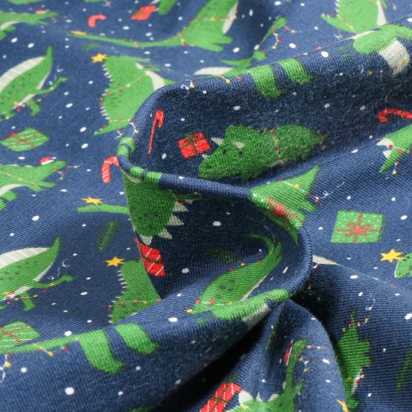 Tissu Jersey Coton Dino Christmas sur fond Bleu marine - Par 10 cm