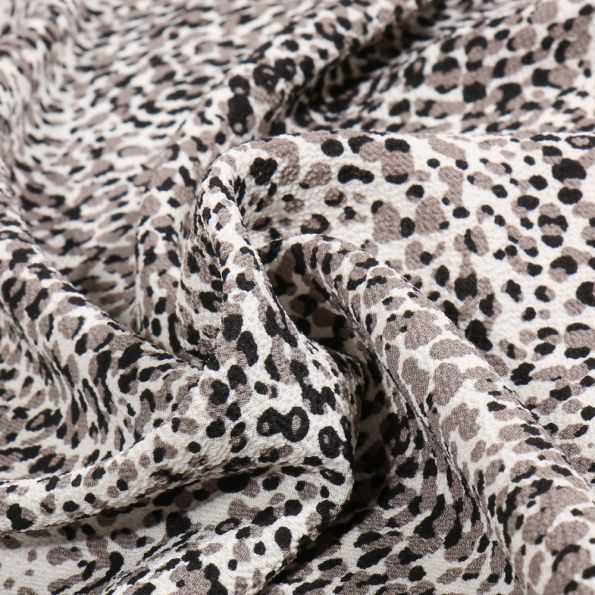 Tissu Crêpe Steffy Panthère sur fond Gris - Par 10 cm