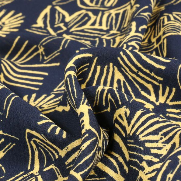 Tissu Crêpe Georgette Makao sur fond Bleu marine - Par 10 cm