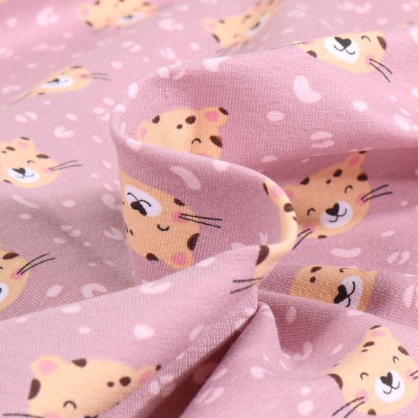 Tissu Jersey Coton Panthère mimi sur fond Rose pâle - Par 10 cm