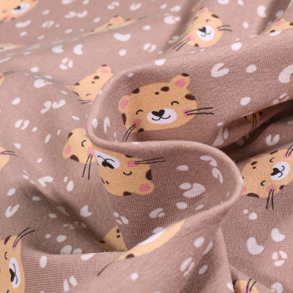 Tissu Jersey Coton Panthère mimi sur fond Taupe - Par 10 cm