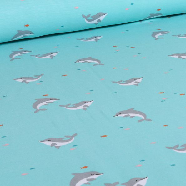 Tissu Jersey Coton Dauphins sur fond Bleu lagon - Par 10 cm