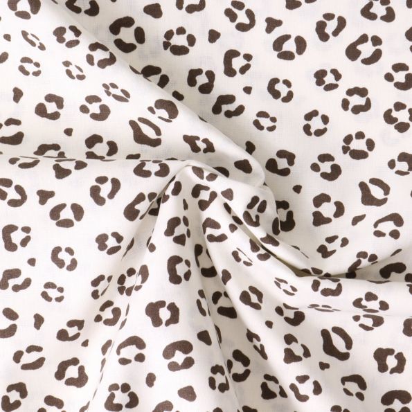 Tissu Popeline de Coton panthère Isis sur fond Beige clair - Par 10 cm