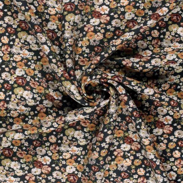 Tissu Crêpe de Viscose Bérengère fleurs Blanches sur fond Noir - Par 10 cm