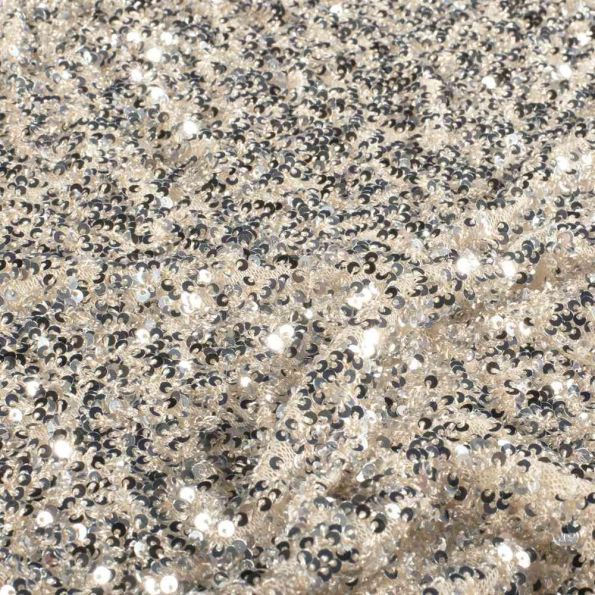 Tissu Sequins Cosmos sequins Argentés sur fond Beige nacré - Par 10 cm