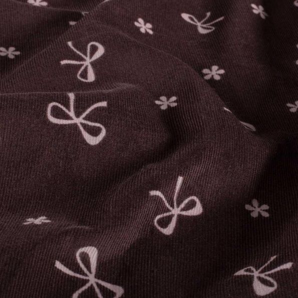 Tissu Velours milleraies Isaé noeuds Roses sur fond Prune foncé - Par 10 cm