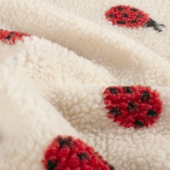 Tissu Fausse fourrure Mouton Lison coccinelles Rouges sur fond Beige - Par 10 cm