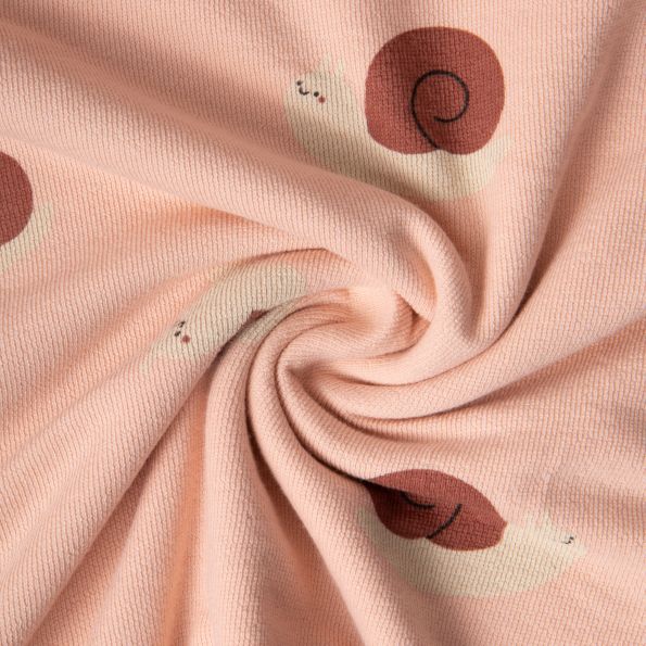 Tissu Maille Jersey Coton Lina escargots sur fond Rose nude - Par 10 cm
