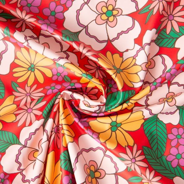Tissu Imperméable déperlant Belonia Fleurs Belone sur fond Rouge - Par 10 cm