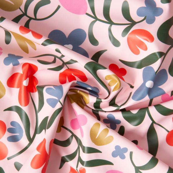 Tissu Imperméable imprimé Fleuris Pamel sur fond Rose clair - Par 10 cm