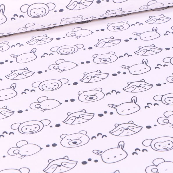 Tissu Jersey coton Têtes d'animaux noir et blanc sur fond Blanc - Par 10 cm