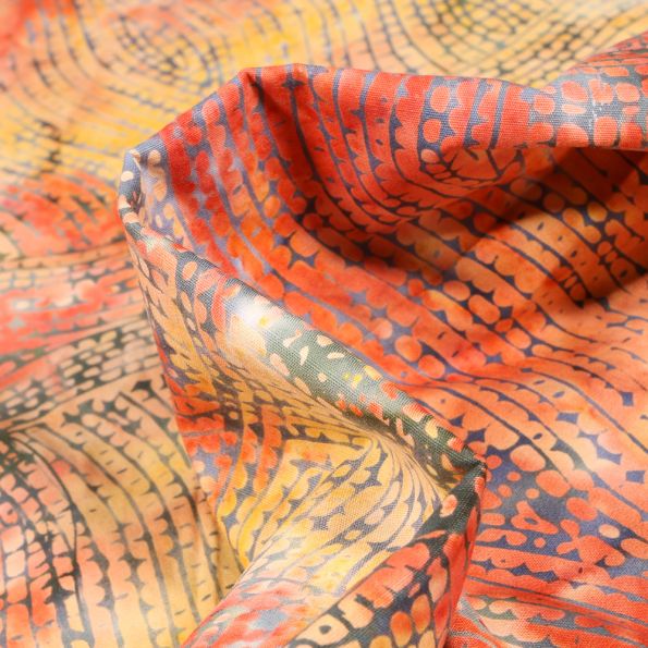 Tissu Batik Teipo sur fond Orange - Par 10 cm
