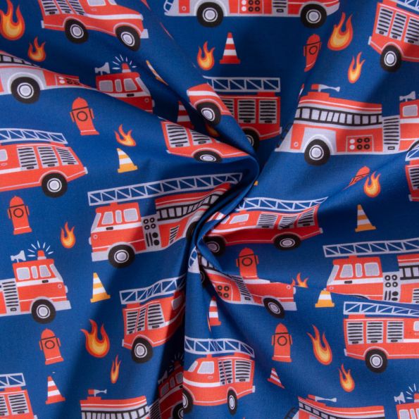 Tissu Coton imprimé Camions de pompiers sur fond Bleu roi - Par 10 cm