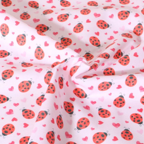 Tissu Coton imprimé Petite Chance animaux sur fond Rose pâle - Par 10 cm