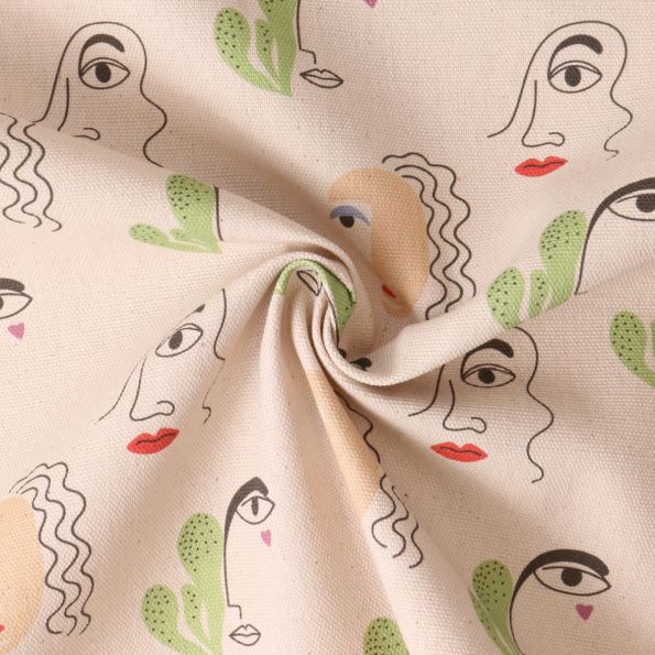 Tissu coton imprimé Cielo Dessin visages sur fond Beige - Par 10 cm