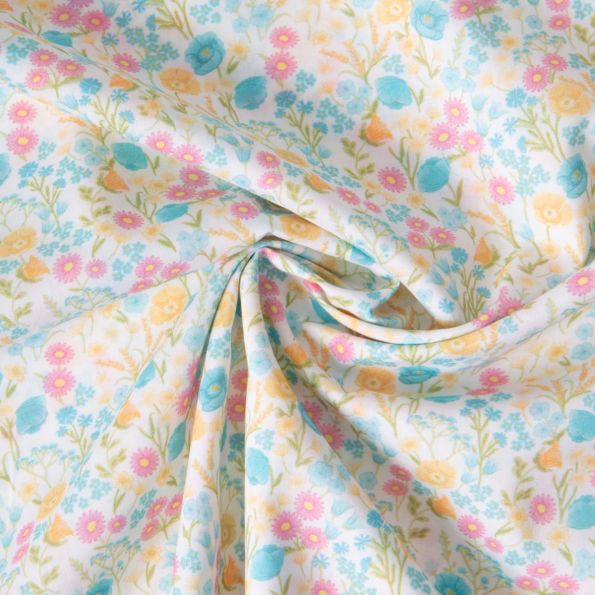 Tissu Popeline de Coton légère fleurs pastel miel, bleu azur et vert prairie sur fond Blanc - Par 10 cm