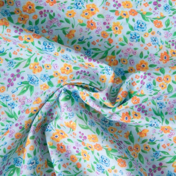 Tissu Voile de Coton digital imprimé Jardin d'été sur fond Bleu ciel - Par 10 cm