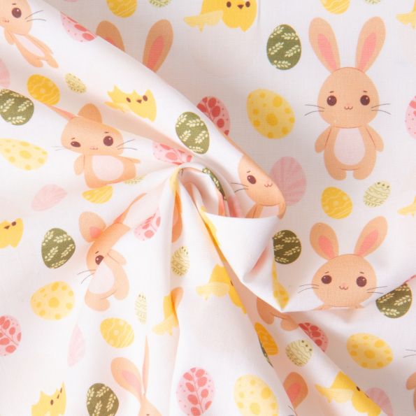 Tissu Coton imprimé Lapins et oeufs de Pâques sur fond Blanc - Par 10 cm