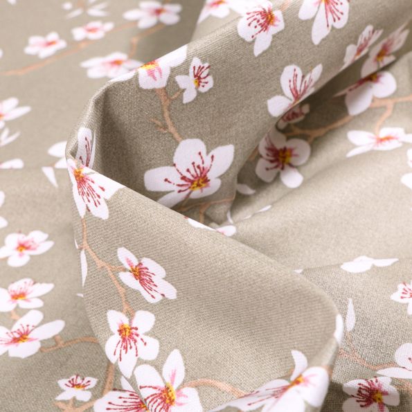 Tissu Coton enduit Fleur d'amandier sur fond Taupe - Par 10 cm