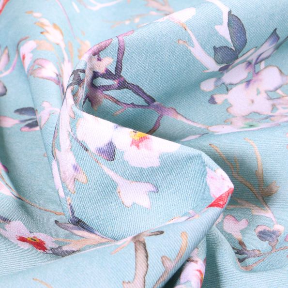 Tissu Toile de Coton Fleur Aquarelle sur fond Bleu ciel - Par 10 cm
