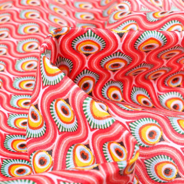 Tissu Coton enduit Feuilles de Paon sur fond Rose - Par 10 cm