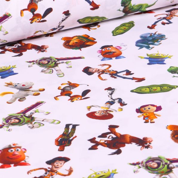 Tissu Disney Toy Story academy sur fond Blanc - Par 10 cm