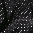 Tissu Coton enduit Petits pois blancs sur fond Noir - Par 10 cm