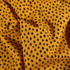 Tissu Jersey Coton Gouttes noires sur fond Jaune - Par 10 cm