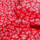 Tissu Coton imprimé Petites branches sur fond Rouge