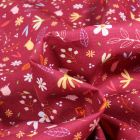 Tissu Coton imprimé Flower power sur fond Grenat