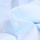 Tissu Plumetis Coton Petites fleurs brodées sur fond Bleu ciel